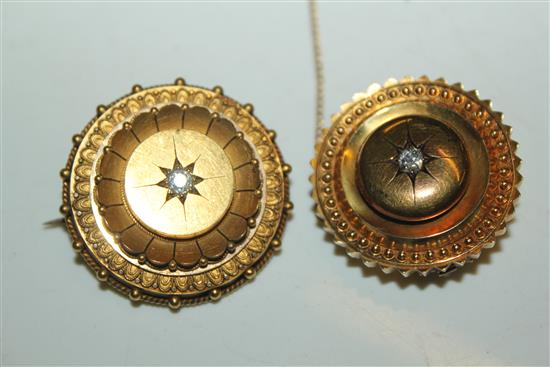 2 x gold and diamond target brooches